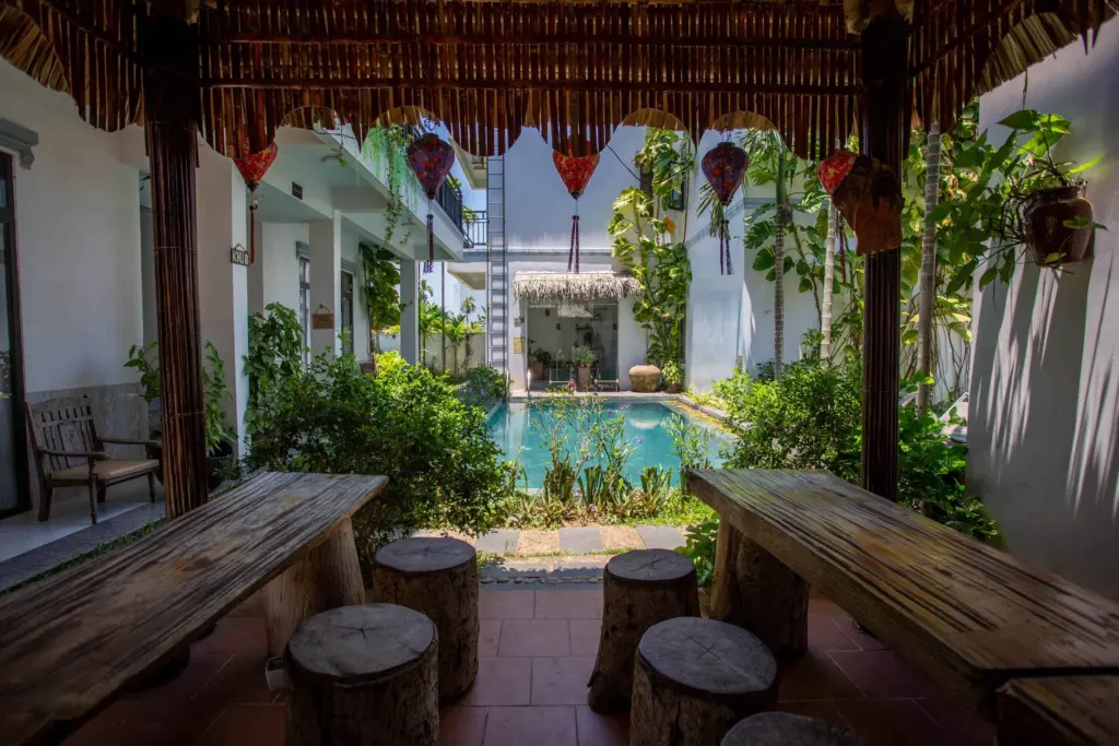 Best Time to Visit Hoi An: Every Season Has a Reason to Go 5 Lantern-lit thatched hut by the pool at Fairy Garden Villa, a cosy spot to watch the rain