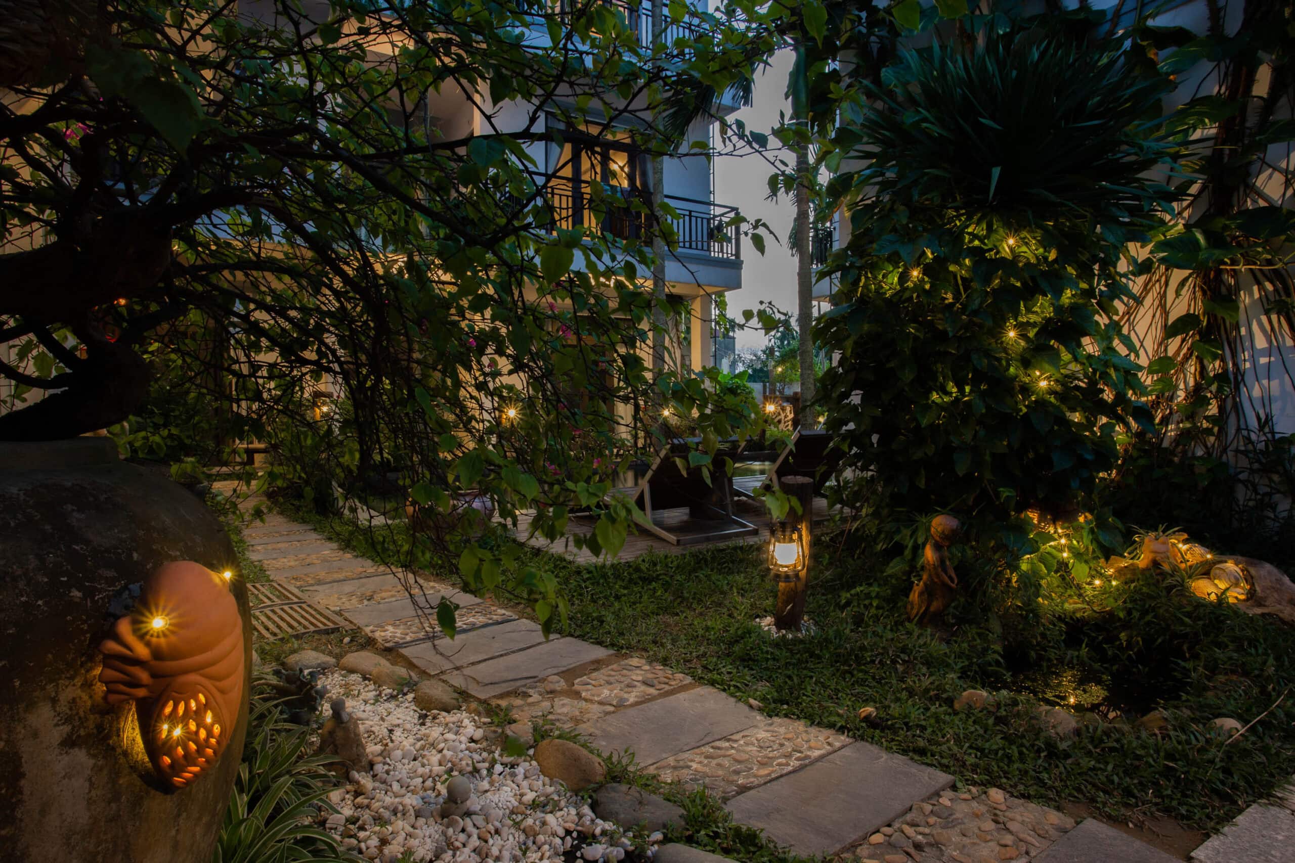 Lantern-lit garden path at Fairy Garden Villa