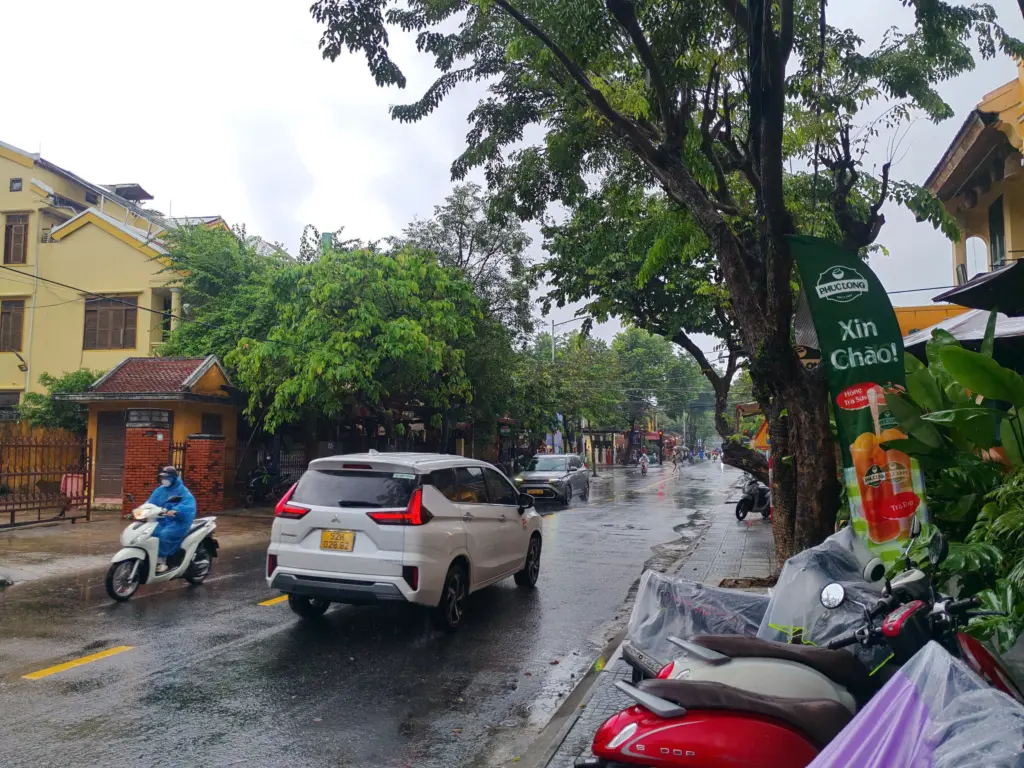 Best Time to Visit Hoi An: Every Season Has a Reason to Go 4 A Hoi An street after the rain, wet road and green trees